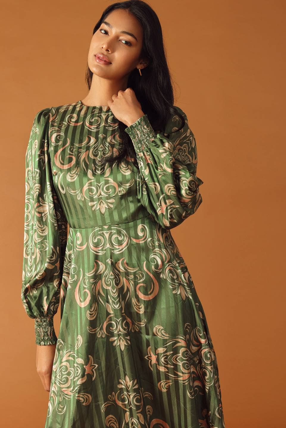 An Olive Green Midi Dress with Gold Scroll Designs